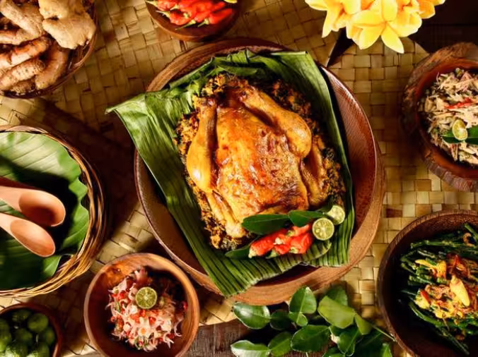 Traditional Balinese dishes being prepared in a cooking class at Rimbun Farm, showcasing local culinary arts.